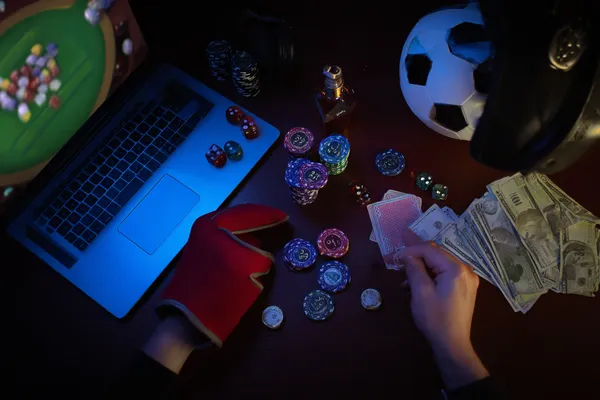 A glowing roulette wheel with cascading chips, symbolizing the engaging live and instant-win games available on QWE123.