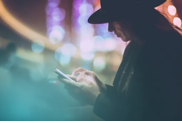 A woman in a luxurious green gown next to an ornate roulette wheel, capturing the upscale casino mood of QWE123.