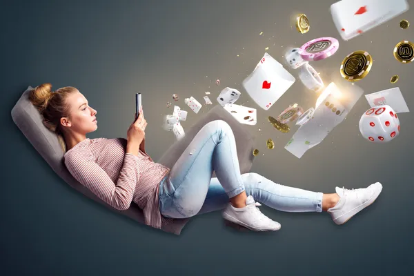 A player using their smartphone during a festive local event, representing QWE123’s fully mobile-friendly casino.